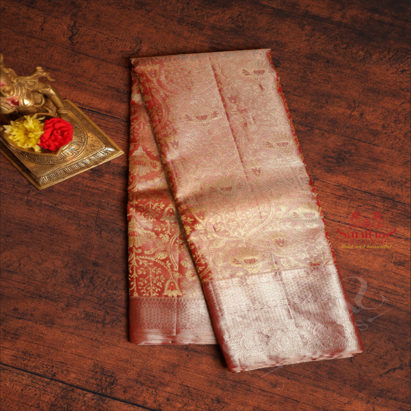 LIGHT RED COLOUR BODY WITH JACQUARD FLORAL EMBOSED WITH CONTRAST BLOUSE & BORDER