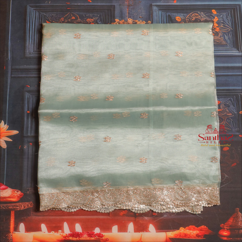 TIFFANY BLUE COLOUR ORGANZA TISSUE SAREE WITH FANCY FLORAL BORDER AND BUTTA WITH SELF BLOUSE