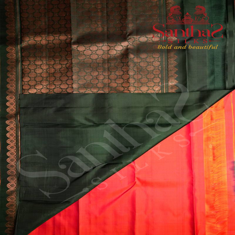 BORDERLESS ORANGISH RED MIXED COLOUR BODY WITH SILVER AND COPPER ZARI STRIPS WITH BUTTAS AND DARK GREEN CONTRAST BLOUSE