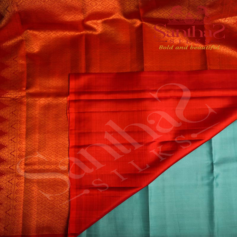 ICE BLUE COLOUR BODY WITH COPPER ZARI STRIPS AND ORANGE COLOUR CONTRAST BLOUSE