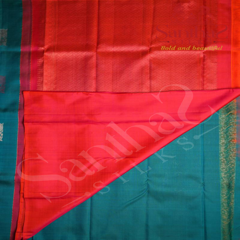 BORDERLESS PEACOCK BLUE COLOUR BODY WITH BIG MOTIFS AND ORANGISH ROSE CONTRAST BLOUSE