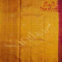 BORDERLESS DARK YELLOW COLOUR WITH MAROON COLOUR THREAD SMALL CHECKED BOXS AND MAROON CONTRAST BLOUSE