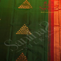 BORDERLESS DARK GREEN COLOUR BODY WITH COPPER AND GOLDEN ZARI TRIANGLE MOTIFS AND CONTRAST BLOUSE