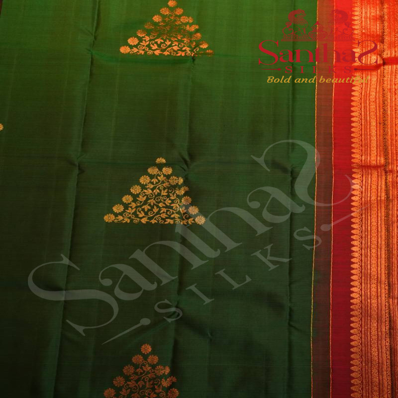 BORDERLESS DARK GREEN COLOUR BODY WITH COPPER AND GOLDEN ZARI TRIANGLE MOTIFS AND CONTRAST BLOUSE