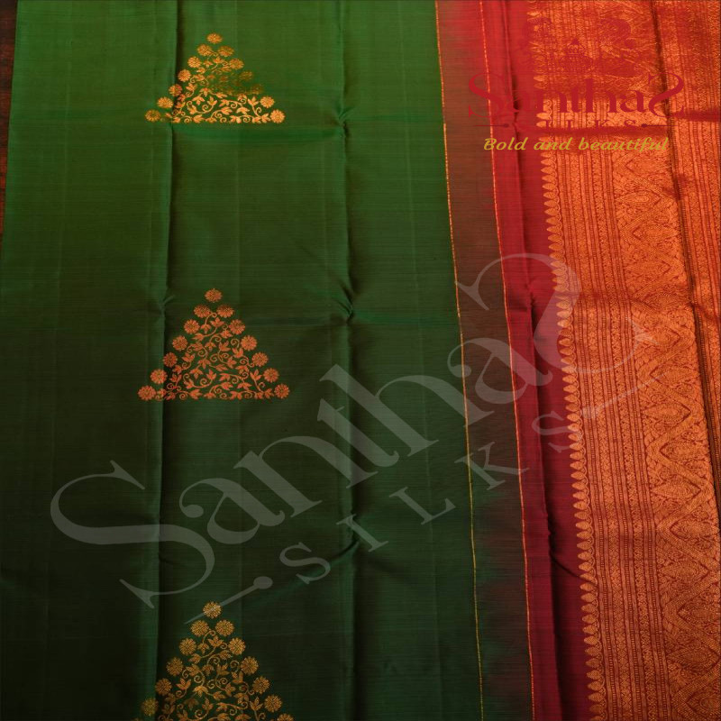 BORDERLESS BOTTLE GREEN COLOUR BODY WITH GOLDEN & COPEER ZARI TRIANGLE MOTIFS AND CONTRAST BLOUSE