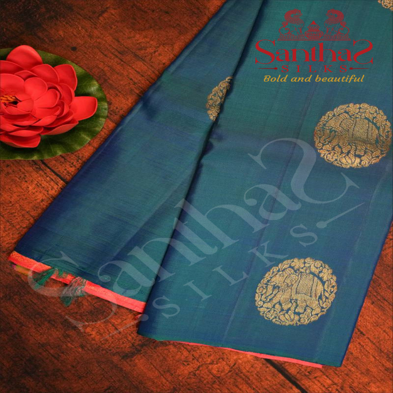 BORDERLESS PEACOCK BLUE COLOUR BODY WITH GOLDEN ZARI ELEPHANT MOTIFS AND CONTRAST BLOUSE