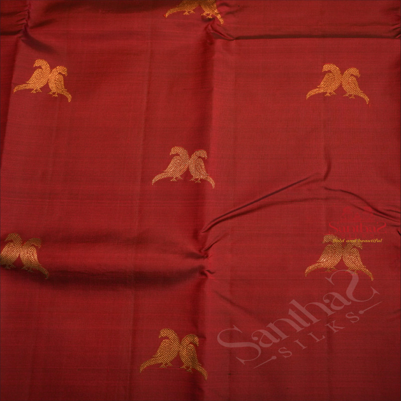 MAROON COLOUR BODY WITH GOLDEN ZARI PARROT MOTIFS AND CONTRAST COLOUR BLOUSE AND PALLU