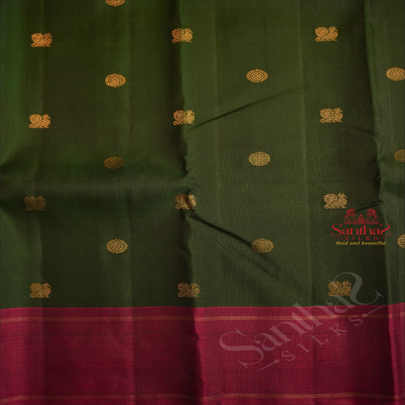 DARK GREEN COLOUR BODY WITH GOLDEN ZARI SMALL CHAKRA BUTTAS & PEACOCK MOTIFS AND CONTRAST COLOUR BLOUSE & PALLU