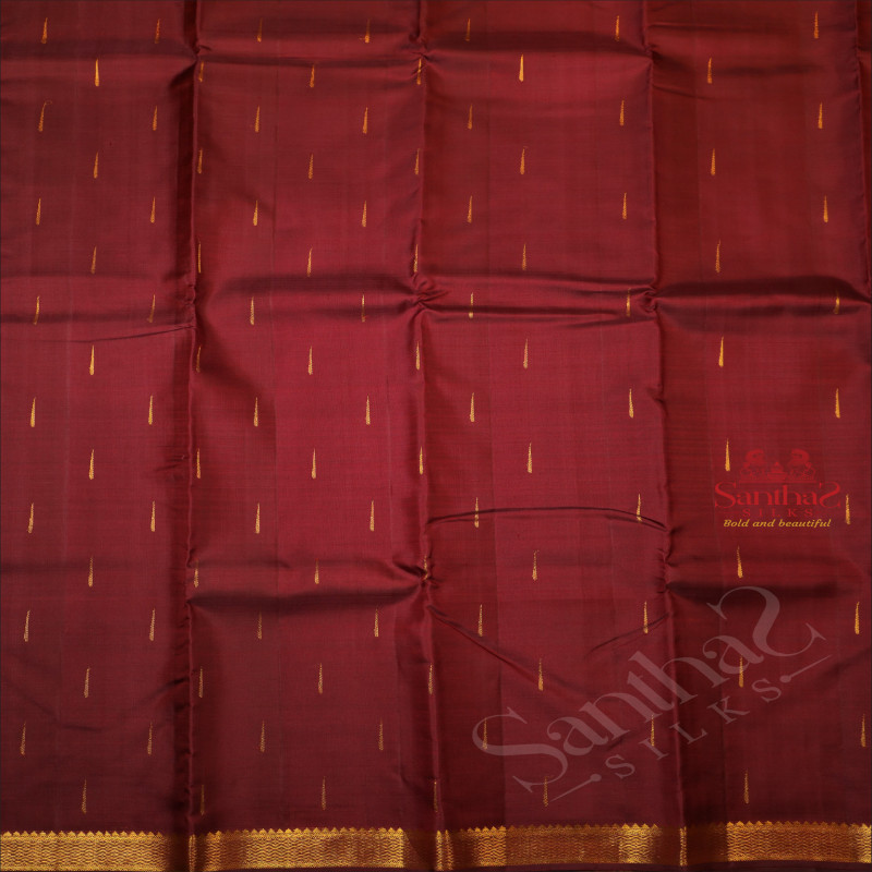 MAROON COLOUR BODY WITH GOLDEN ZARI MOTIF AND BORDER WITH SELF BLOUSE