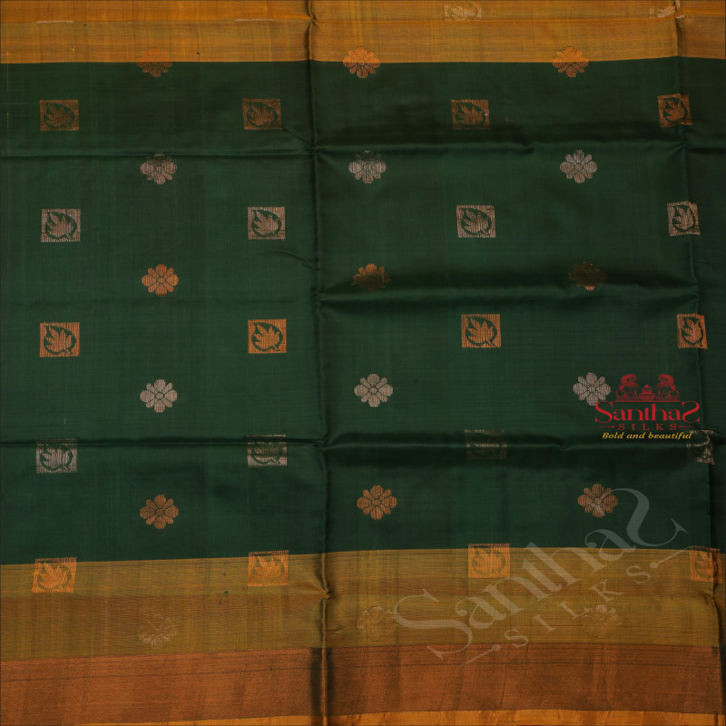BOTTLE GREEN COLOUR BODY WITH GOLDEN AND SILVER ZARI LEAF FLOWER BUTTA WITH CONTRAST BLOUSE & BORDER